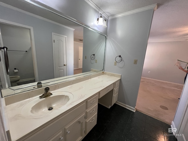 bathroom featuring toilet, vanity, a textured ceiling, and crown molding