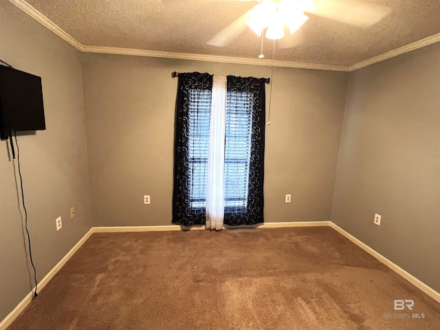 spare room with a textured ceiling, ceiling fan, carpet, and crown molding