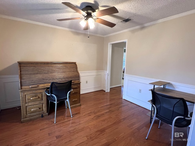 home office with dark hardwood / wood-style flooring, a textured ceiling, ceiling fan, and crown molding