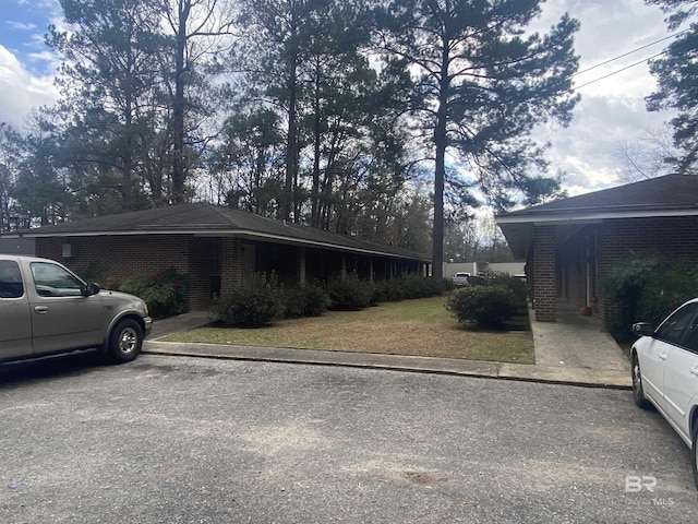 view of property exterior featuring a yard