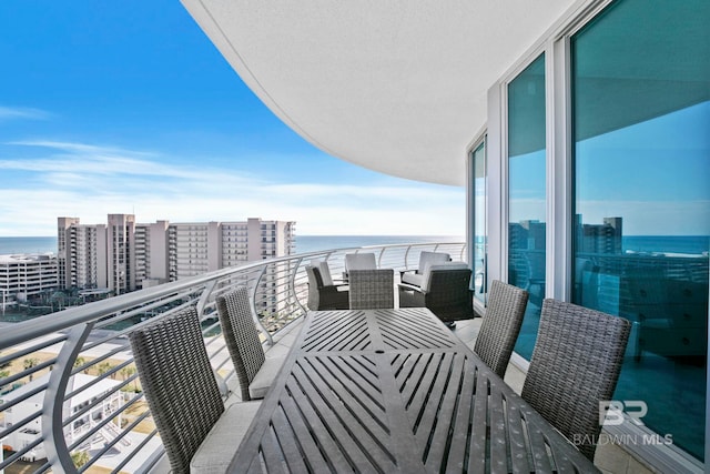 balcony featuring a water view