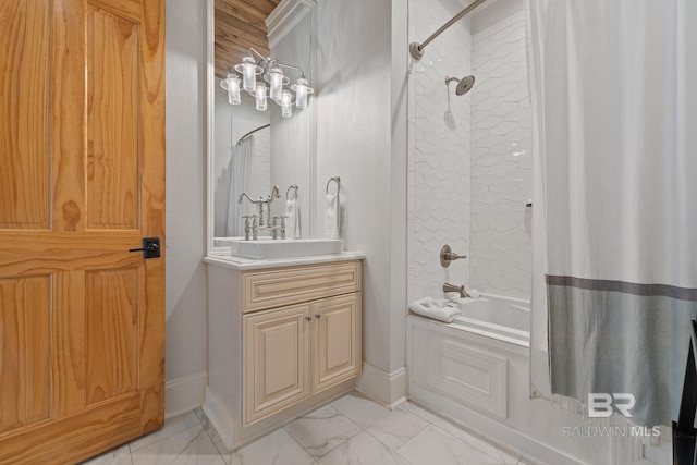 bathroom with marble finish floor, shower / bathtub combination with curtain, baseboards, and vanity