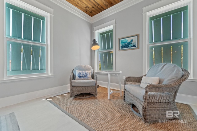 living area with plenty of natural light, baseboards, crown molding, and wooden ceiling