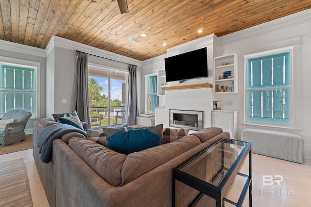 living area featuring recessed lighting, ornamental molding, wood ceiling, visible vents, and a glass covered fireplace