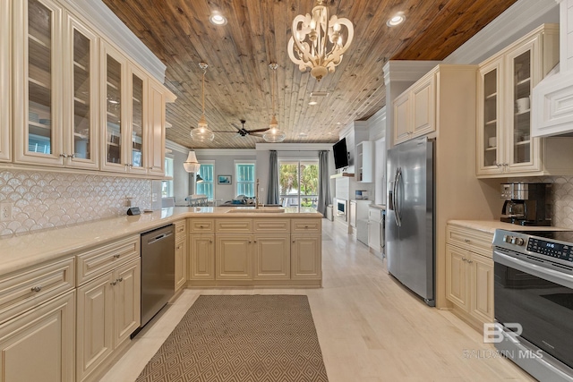 kitchen featuring light countertops, a peninsula, ornamental molding, appliances with stainless steel finishes, and wooden ceiling