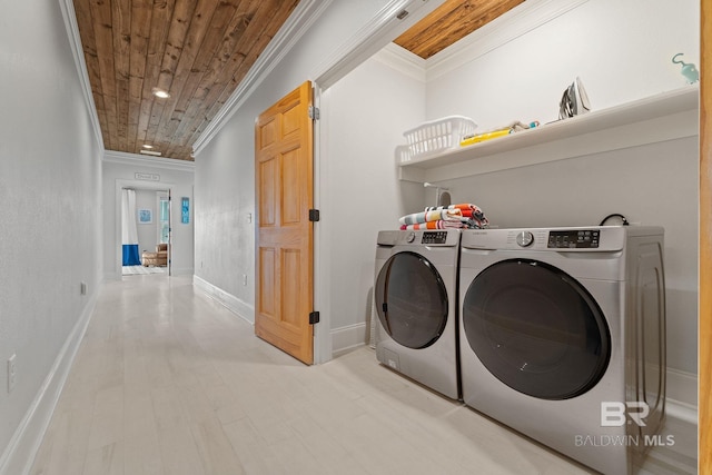 laundry area featuring independent washer and dryer, crown molding, laundry area, and wood ceiling