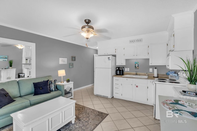 1118 W Beach Blvd Unit 4, Gulf Shores, AL 36542 - kitchen with a ceiling fan, white appliances, a sink, light tile patterned floors, and ornamental molding