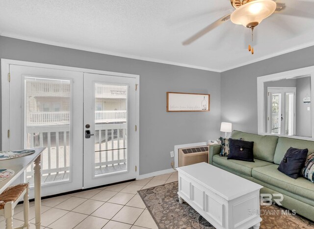 1118 W Beach Blvd Unit 4, Gulf Shores, AL 36542 - living area with french doors, ornamental molding, light tile patterned flooring, a ceiling fan, and baseboards