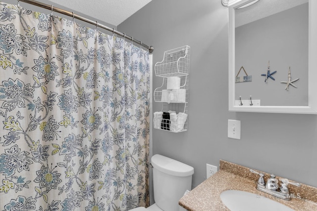 1118 W Beach Blvd Unit 4, Gulf Shores, AL 36542 - full bath featuring vanity, toilet, a textured ceiling, and a shower with curtain