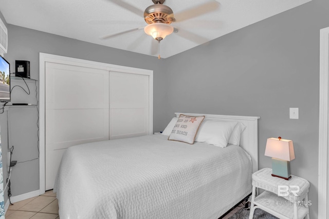 1118 W Beach Blvd Unit 4, Gulf Shores, AL 36542 - bedroom with a ceiling fan, light tile patterned flooring, and a closet