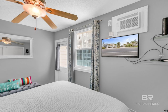 1118 W Beach Blvd Unit 4, Gulf Shores, AL 36542 - bedroom with a wall mounted AC and ceiling fan