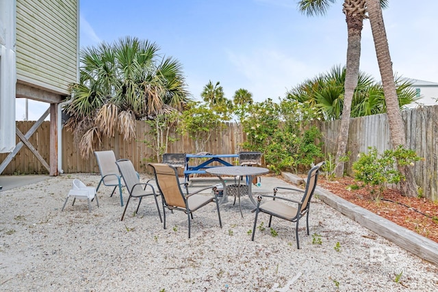 1118 W Beach Blvd Unit 4, Gulf Shores, AL 36542 - fenced backyard with a patio area and outdoor dining area