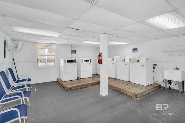1118 W Beach Blvd Unit 4, Gulf Shores, AL 36542 - below grade area featuring washing machine and dryer, a paneled ceiling, and a sink