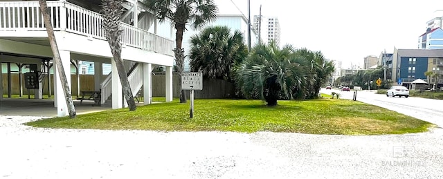 1118 W Beach Blvd Unit 4, Gulf Shores, AL 36542 - view of grassy yard featuring a carport