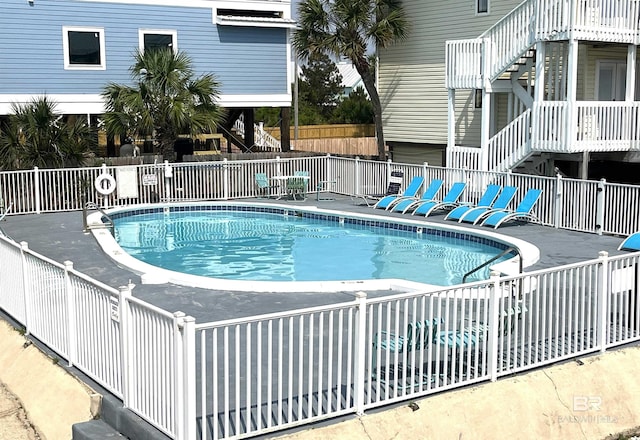1118 W Beach Blvd Unit 4, Gulf Shores, AL 36542 - community pool with stairway and a patio area