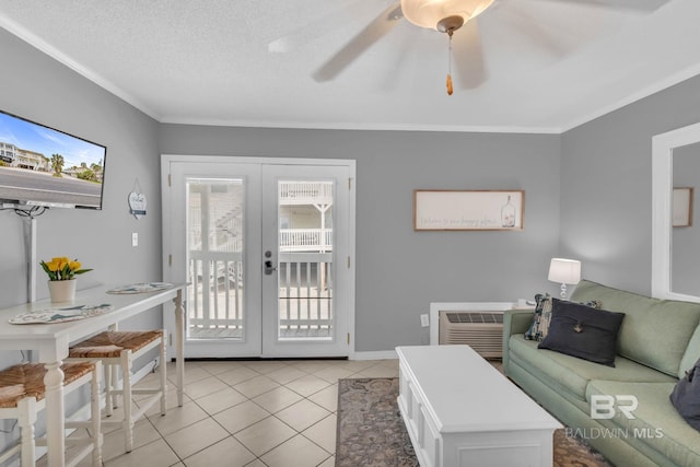 1118 W Beach Blvd Unit 4, Gulf Shores, AL 36542 - living area with french doors, light tile patterned floors, ornamental molding, a ceiling fan, and baseboards
