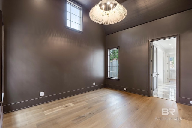 spare room with light hardwood / wood-style floors