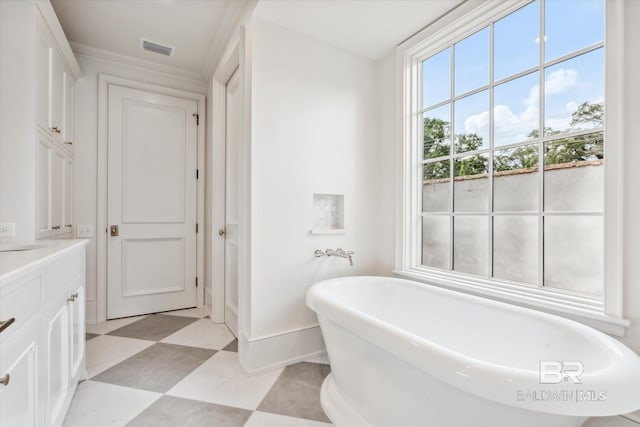 bathroom with vanity and a bath