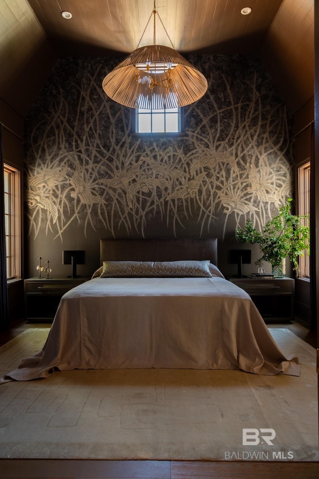 bedroom featuring high vaulted ceiling and wood ceiling