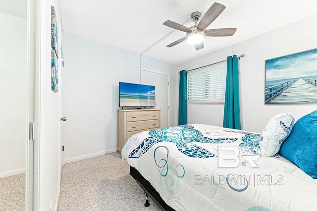 bedroom featuring baseboards, carpet, and ceiling fan
