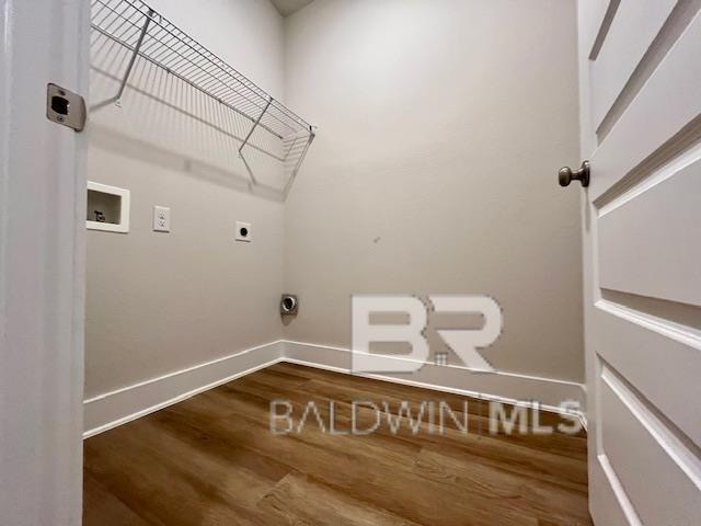 laundry area with hardwood / wood-style flooring, hookup for a washing machine, and electric dryer hookup