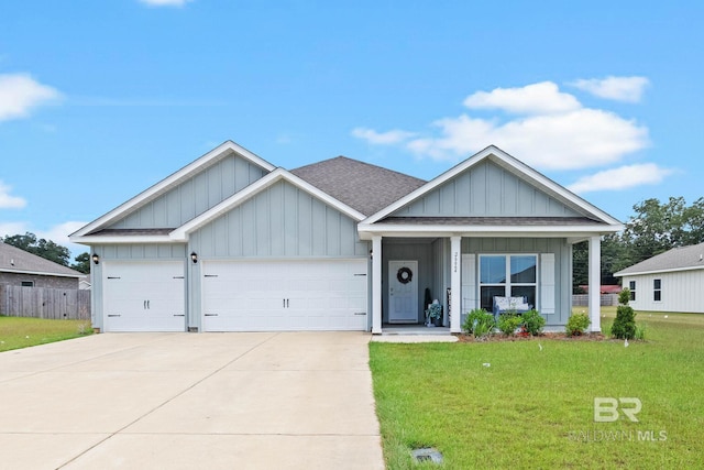 view of front of house with a garage and a front yard