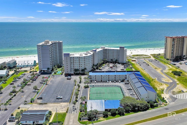 birds eye view of property featuring a beach view and a water view