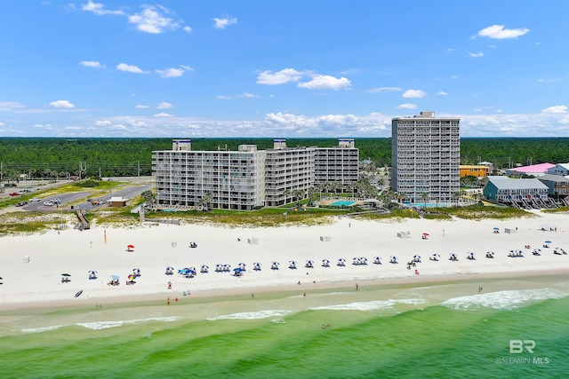 drone / aerial view with a water view and a view of the beach