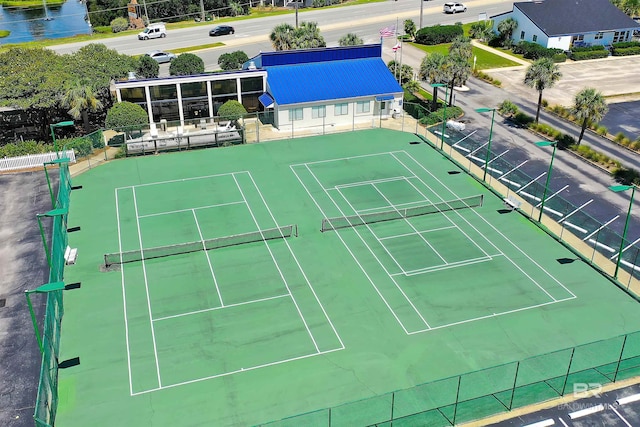 view of tennis court with fence