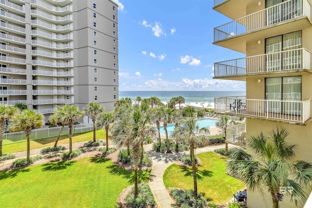 exterior space with a lawn and a water view