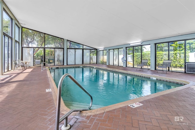 pool featuring a lanai and a patio