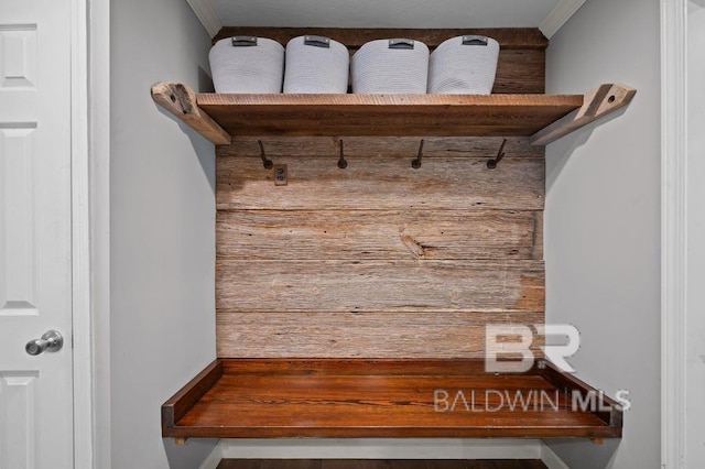mudroom featuring crown molding