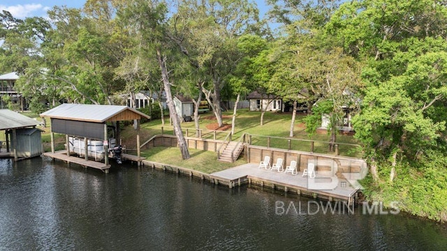 dock area with a water view and a lawn