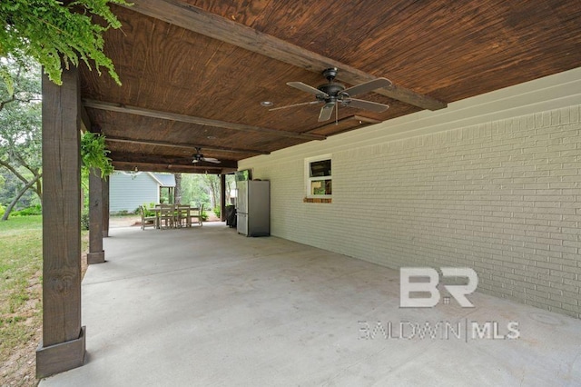 view of patio featuring a ceiling fan and outdoor dining space