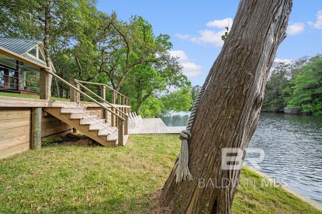 view of yard with a water view and stairs