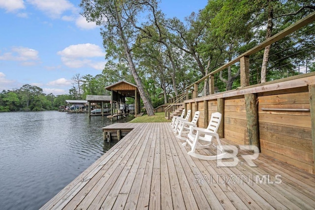dock area featuring a water view and stairs