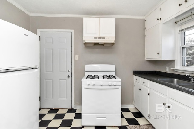 kitchen with white appliances, white cabinets, under cabinet range hood, and light floors