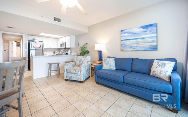 533 W Beach Blvd Unit 705, Gulf Shores, AL 36542 - living area featuring light tile patterned floors and a ceiling fan