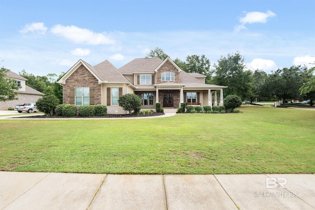 craftsman-style home with a front lawn