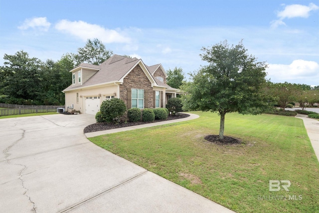 view of front of house with central AC, a front yard, and a garage