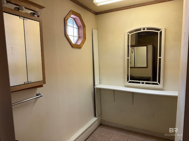 bathroom featuring tile patterned floors and ornamental molding