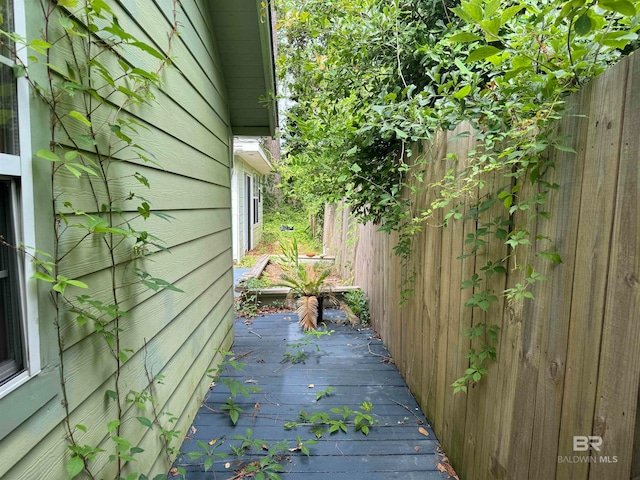 view of side of home featuring a deck