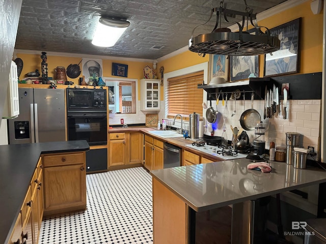 kitchen featuring black appliances, a kitchen breakfast bar, crown molding, sink, and decorative backsplash