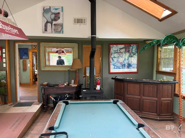 recreation room featuring a wood stove, dark wood-type flooring, billiards, and vaulted ceiling