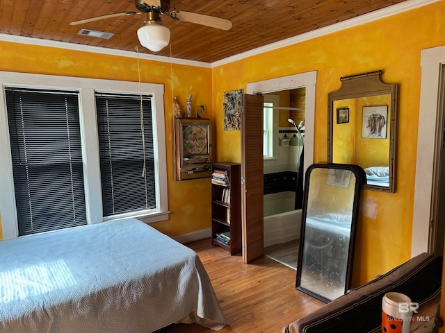 bedroom featuring ceiling fan, wooden ceiling, and ornamental molding