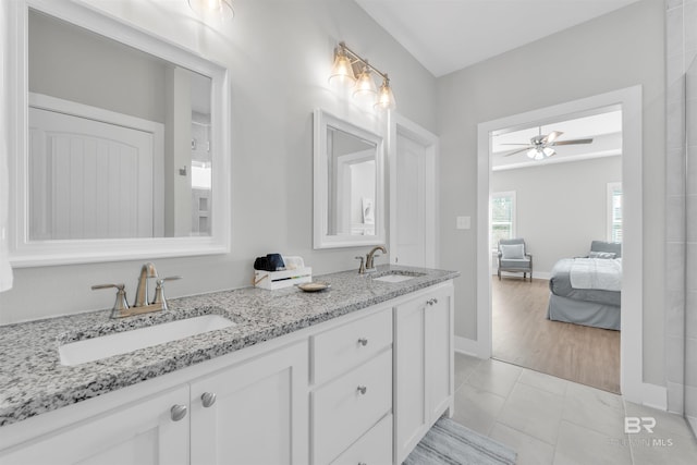 5774 Ono Ave, Pensacola, FL 32507 - ensuite bathroom with a ceiling fan, double vanity, and baseboards