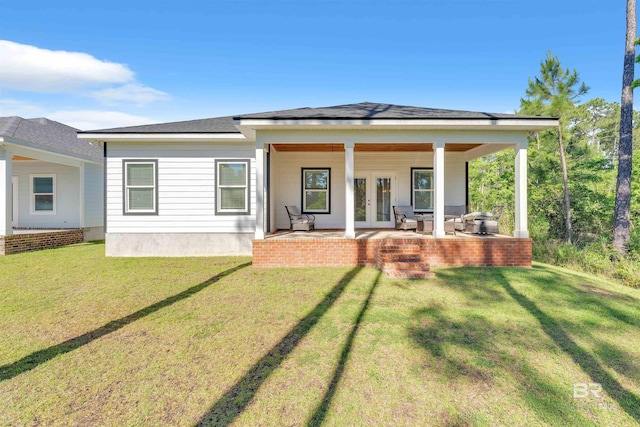 5774 Ono Ave, Pensacola, FL 32507 - back of property featuring french doors, a yard, and roof with shingles
