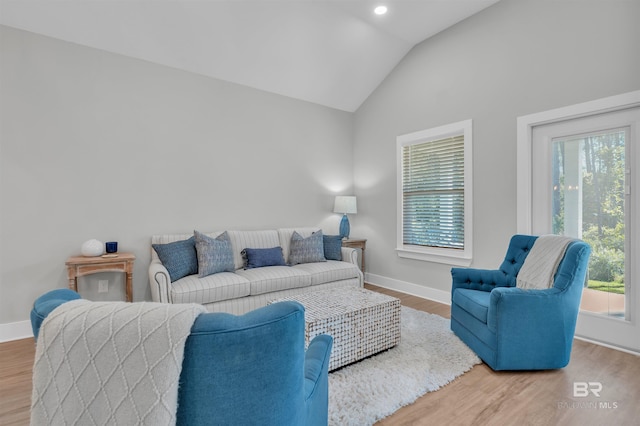 5774 Ono Ave, Pensacola, FL 32507 - living room featuring lofted ceiling, baseboards, and wood finished floors