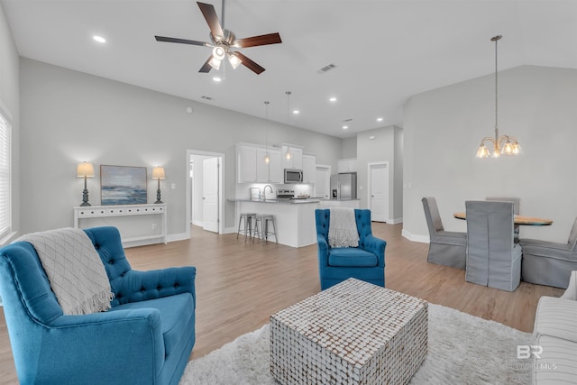 5774 Ono Ave, Pensacola, FL 32507 - living area featuring a chandelier, ceiling fan, light wood finished floors, baseboards, and recessed lighting
