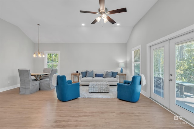 5774 Ono Ave, Pensacola, FL 32507 - living room featuring vaulted ceiling, wood finished floors, a chandelier, baseboards, and ceiling fan